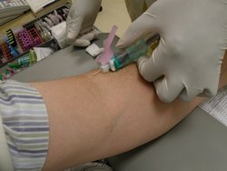 Phlebotomist at work. By Richardelainechambers (Own work) [Public domain], via Wikimedia Commons
